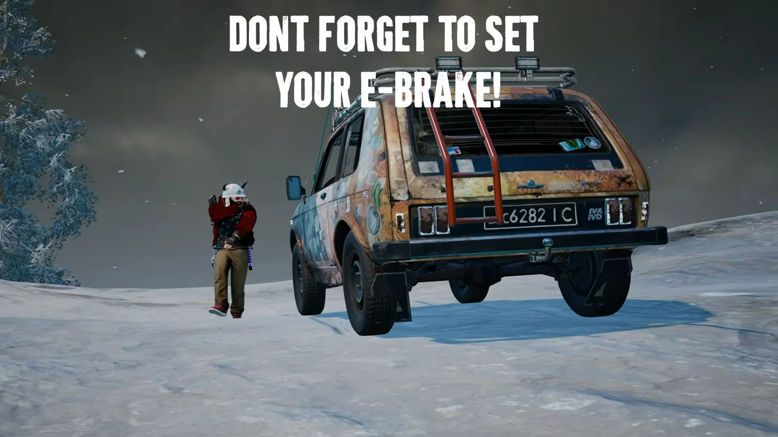 Setting the E-brake on a PUBG vehicle parked on a snowy hill in Vikendi